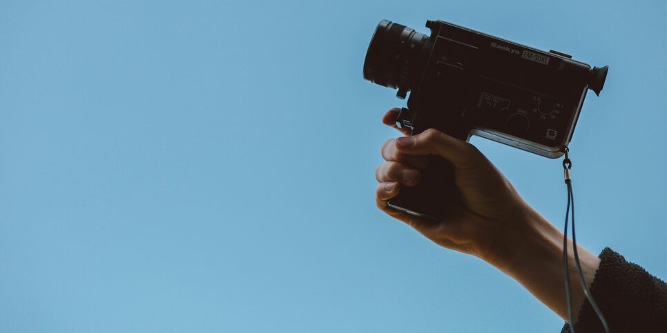 image of someone holding a film camera